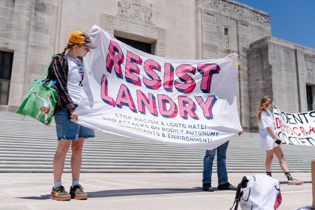 A "Resist Landry" banner flaps in the wind Monday, April 22, 2024, at the Louisiana State Capitol in Baton Rouge, La.