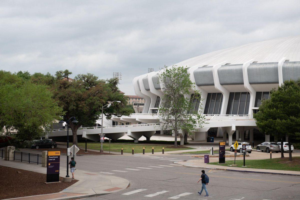 Pedestrians walk pass the Pete Maravich Assembly Center Tuesday, April 9, 2024, on LSU's campus in Baton Rouge, La.