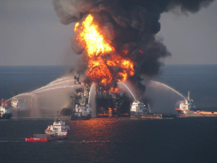 FILE - In this April 21, 2010 file image provided by the U.S. Coast Guard, fire boat response crews battle the blazing remnants of the off shore oil rig Deepwater Horizon. British oil company BP said Thursday Nov. 15, 2012 it is in advanced talks with U.S. agencies about settling criminal and other claims from the Gulf of Mexico well blowout two years ago. In a statement, BP said "no final agreement has yet been reached" and that any such deal would still be subject to court approvals. (AP Photo/US Coast Guard, File)