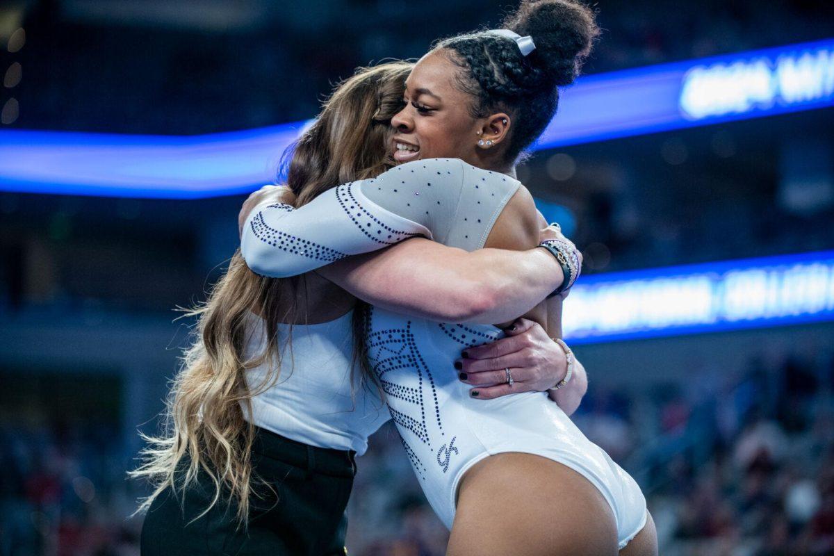 LSU gymnastics freshman all-around Amari Drayton hugs assistant coach Courtney McCool Griffeth after her floor routine during the NCAA Gymnastics Championship on Saturday, April 20, 2024, in Fort Worth, Tx.