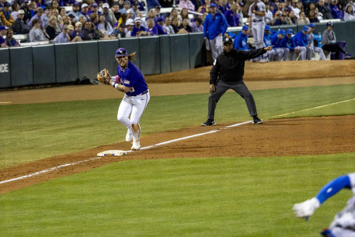 LSU baseball junior third base Tommy White (47) looks to throw the ball Friday, March 22, 2024, during LSU"s 6-1 victory over Florida in Alex Box Stadium.