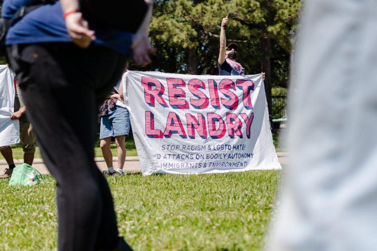 A banner reads "Resist Landry" Monday, April 22, 2024, during a protest outside the Governor's mansion in Baton Rouge, La.