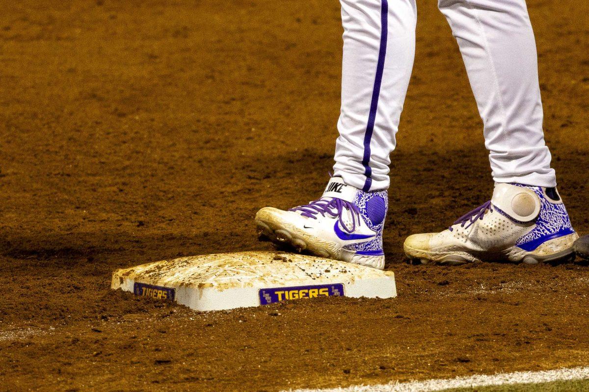 LSU baseball freshman outfield Jake Brown (18) steps on first base Friday, March 22, 2024, during LSU"s 6-1 victory over Florida in Alex Box Stadium.