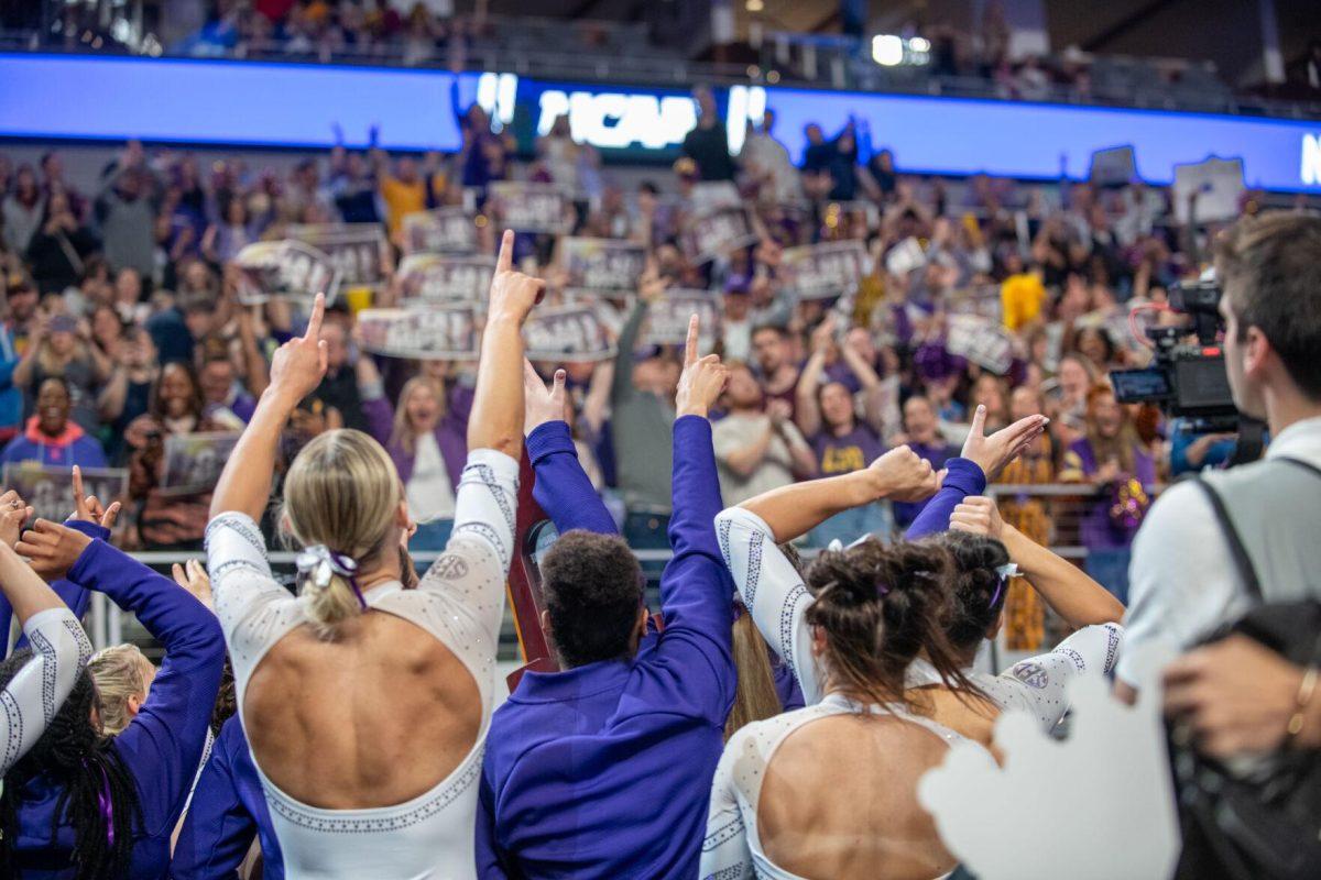 The LSU gymnastics team cheers with the crowd of LSU fans following LSU's NCAA Championship win on Saturday, April 20, 2024, in Fort Worth, Tx.