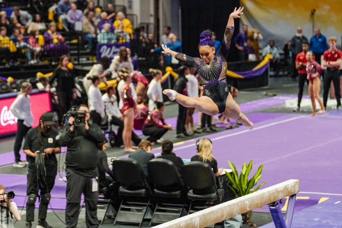 <p>LSU gymnastics all-around freshman Konnor McClain moves through the air Friday, March 1, 2024, during LSU’s 198.325-197.325 win against Alabama in the Pete Maravich Assembly Center in Baton Rouge, La.</p>