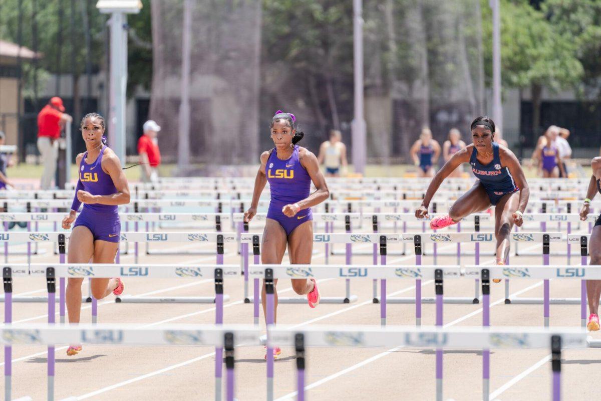 LSU track and field sprints seniors Leah Phillips (left) and Shani'a Bellamy compete in the 100 meter hurdles Saturday, April 27, 2024, at the LSU Invitational in the Bernie Moore Track Stadium in Baton Rouge, La.