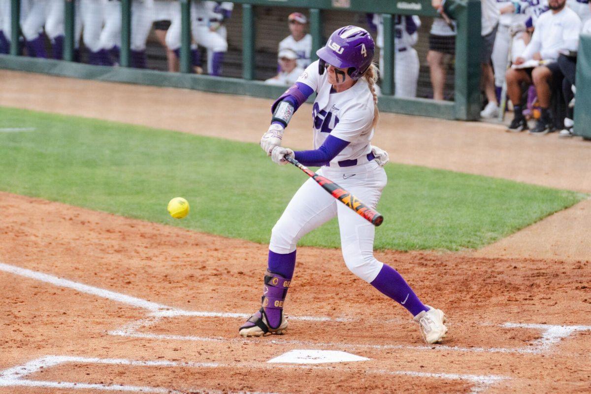 LSU softball junior outfielder McKenzie Redoutey (4) swings for the ball Friday, April 26, 2024, during LSU's 2-1 loss against Arkansas at Tiger Park in Baton Rouge, La.