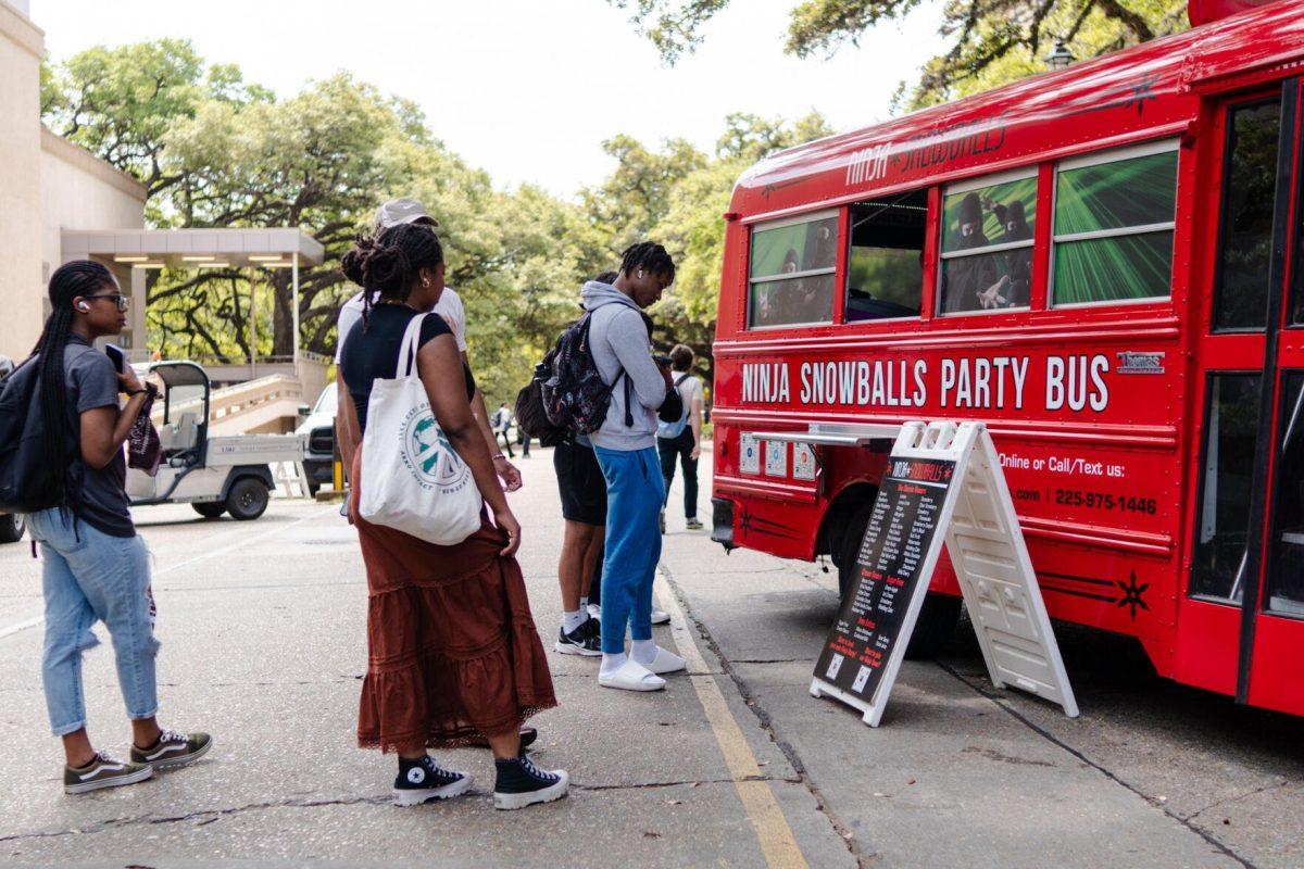 Students wait in line for snowballs Tuesday, April 2, 2024, at the College Council Rodeo on Tower Drive on LSU's campus.