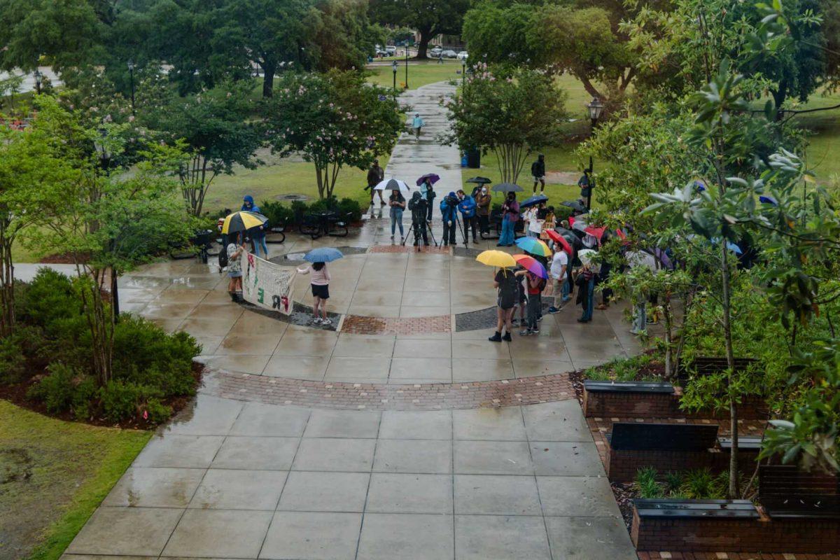 Pro-Palestinian protesters gather Friday, May 3, 2024, outside of Patrick F. Taylor Hall on LSU's campus in Baton Rouge, La.