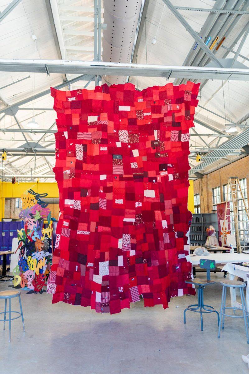 A quilt where each patch represents a report filed with the LSU Title IX office hangs Wednesday, May 1, 2024, inside the Barnes Ogden Art &amp; Design Complex on LSU's campus in Baton Rouge, La.