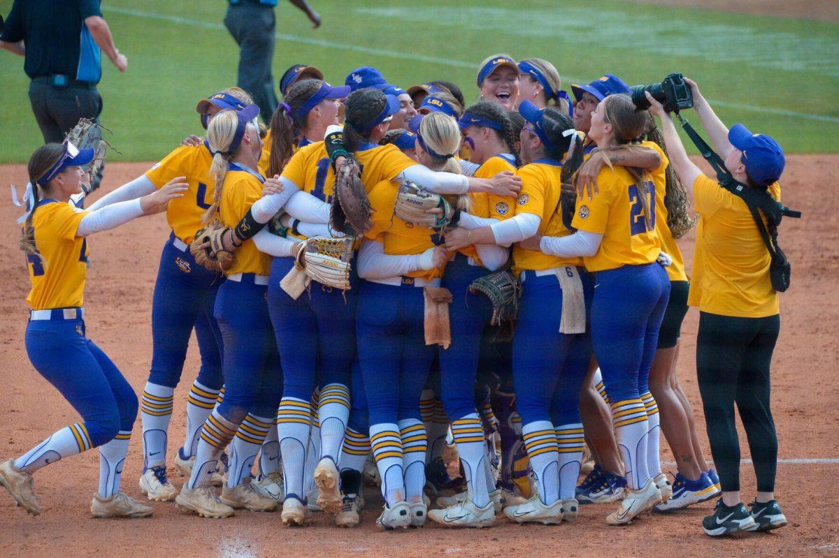 LSU softball players celebrate 9-0 win against Southern Illinois University on Sunday, May 19, 2024, during the NCAA Regional Championship game at Tiger Park in Baton Rouge, La.