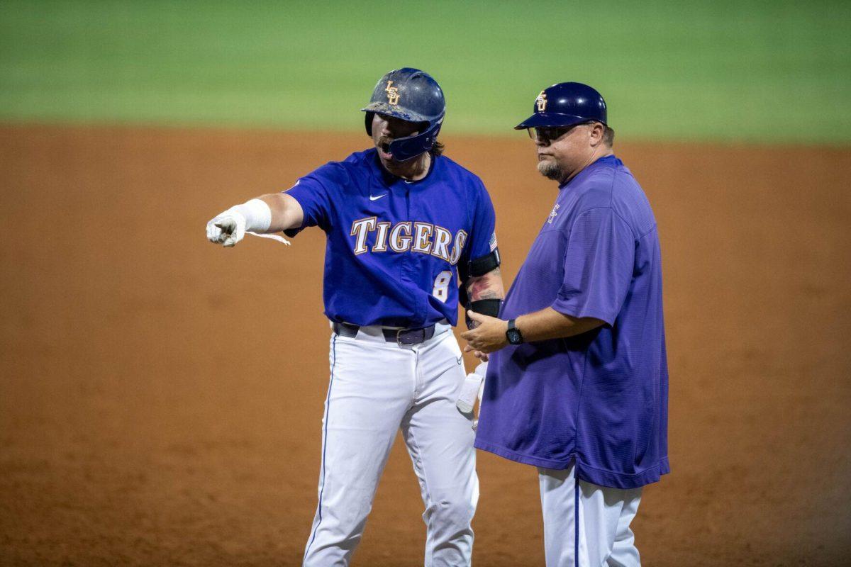 LSU baseball graduate student catcher Hayden Travinski (8) points and cheers at his teammates during LSU's 6-4 win on Saturday, May 4, 2024, at Alex Box Stadium in Baton Rouge, La.