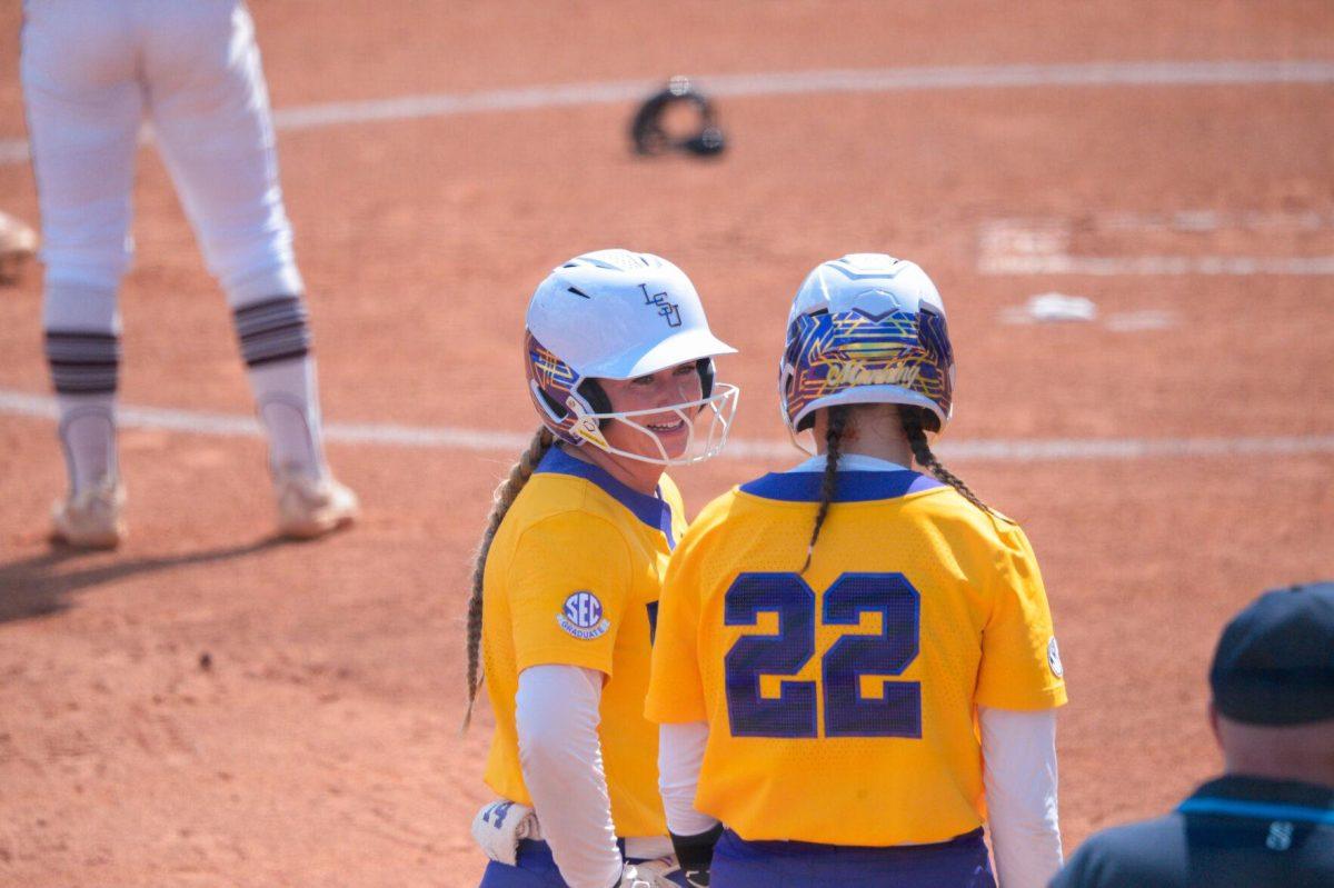 LSU softball graduate student infield Karli Petty (14) and freshman infield Madyson Manning (22) talk game on Sunday, May 19, 2024,&#160;during LSU's&#160;9-0 win against Southern Illinois in the&#160;NCAA Regional Championship game at Tiger Park in Baton Rouge, La.