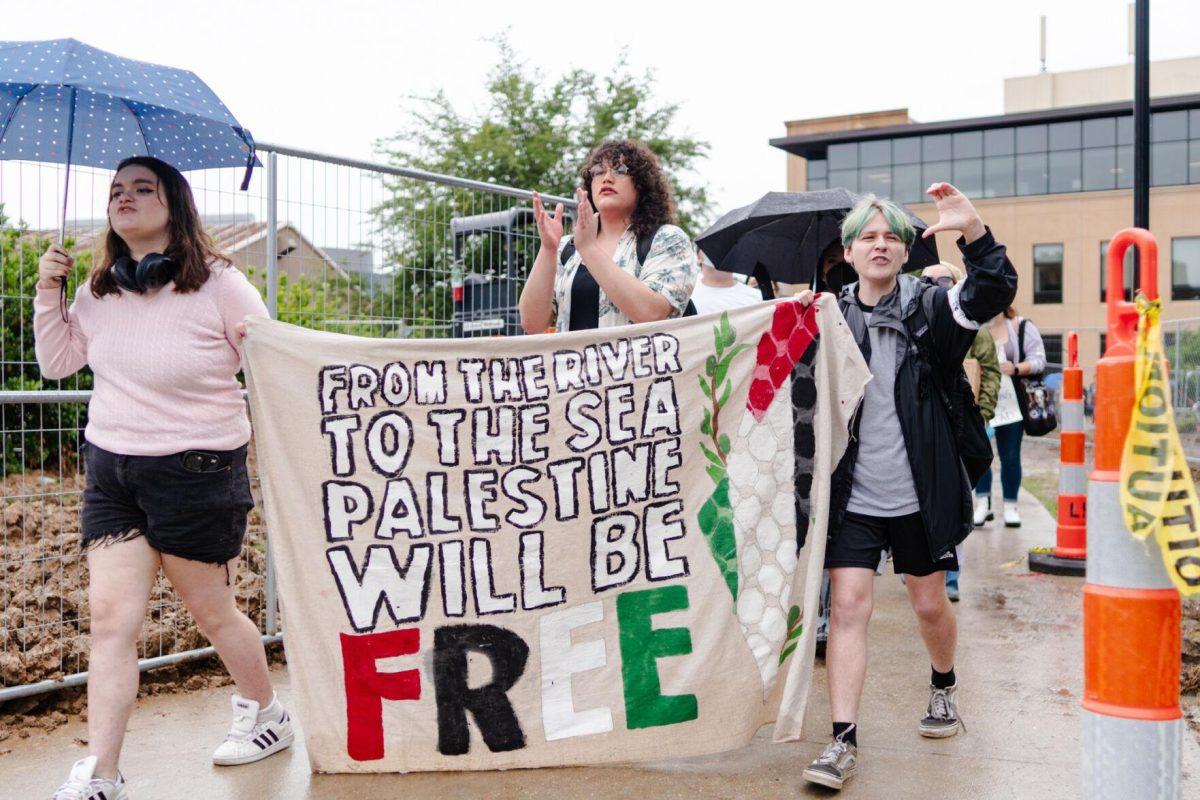 Pro-Palestinian protesters begin to walk to Free Speech Alley Friday, May 3, 2024, from Patrick F. Taylor Hall on LSU's campus in Baton Rouge, La.