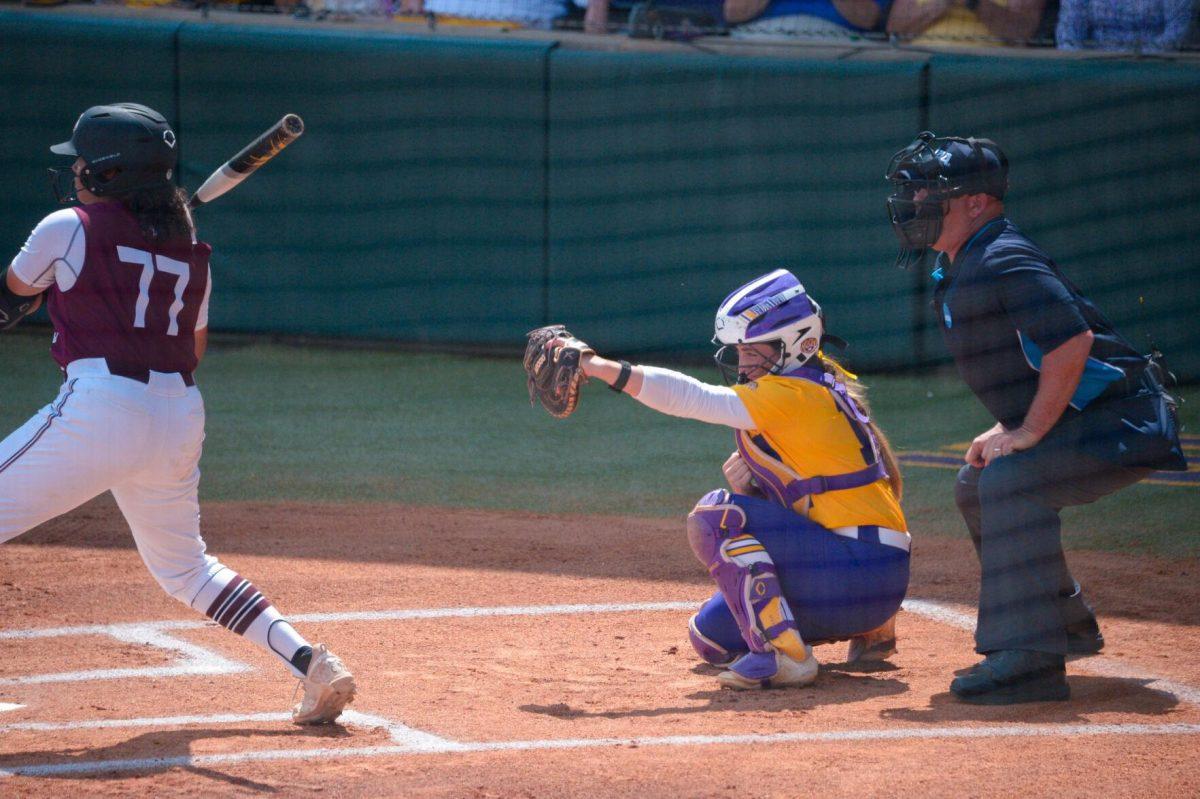 LSU softball sophomore catcher Maci Bergeron (12) catches the ball on Sunday, May 19, 2024,&#160;during LSU's&#160;9-0 win against Southern Illinois in the&#160;NCAA Regional Championship game at Tiger Park in Baton Rouge, La.