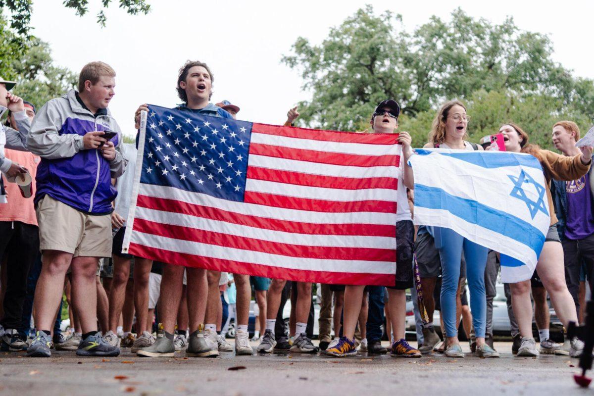 Counter-protesters wave an American flag and an Israeli flag Friday, May 3, 2024, in Free Speech Alley on LSU's campus in Baton Rouge, La.