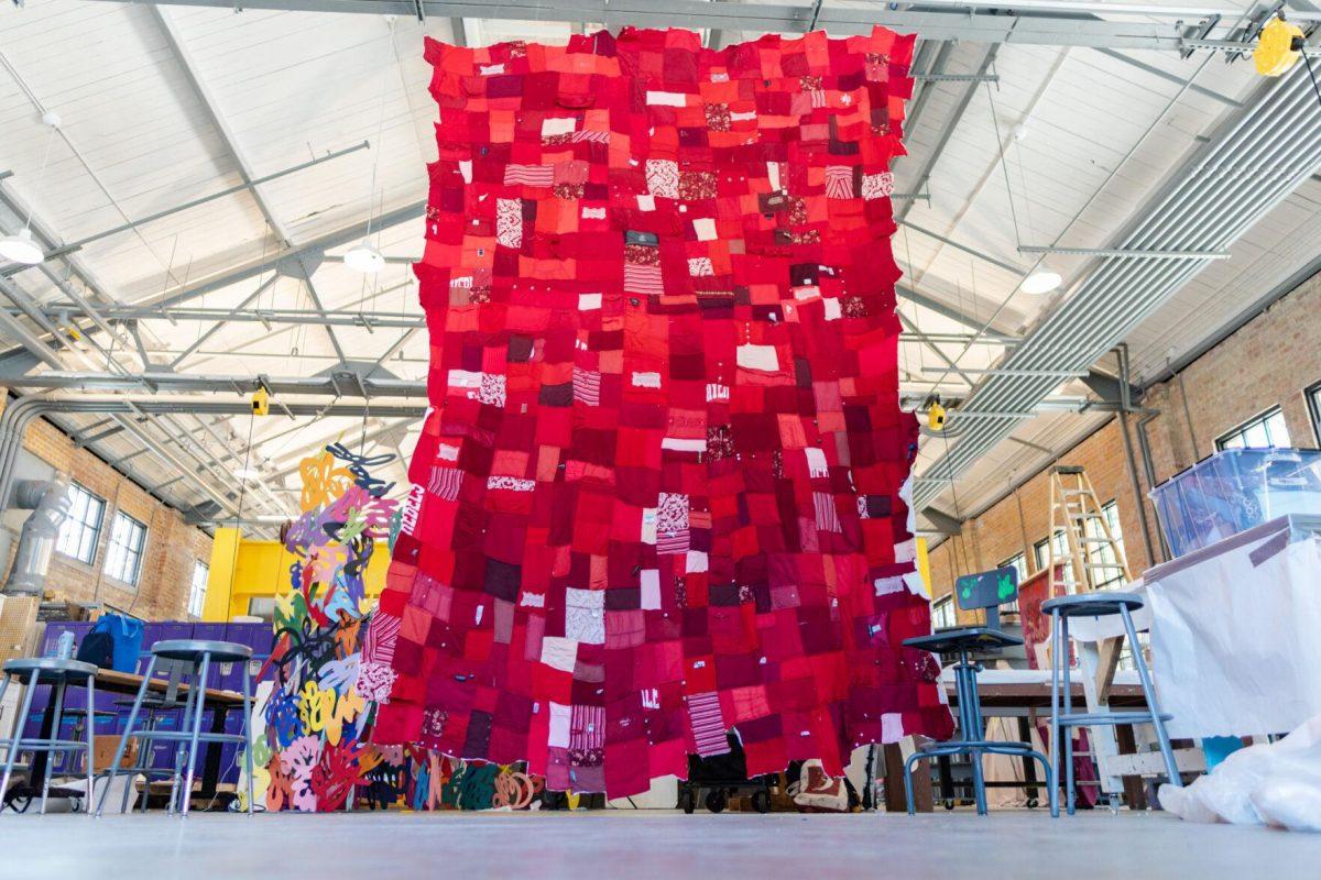 A quilt where each patch represents a report filed with the LSU Title IX office hangs Wednesday, May 1, 2024, inside the Barnes Ogden Art &amp; Design Complex on LSU's campus in Baton Rouge, La.