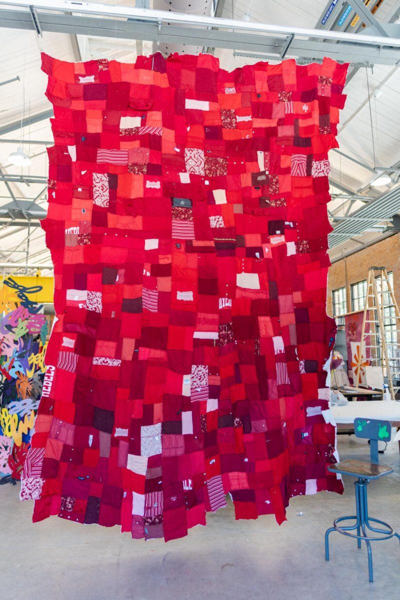 A quilt where each patch represents a report filed with the LSU Title IX office hangs Wednesday, May 1, 2024, inside the Barnes Ogden Art &amp; Design Complex on LSU's campus in Baton Rouge, La.