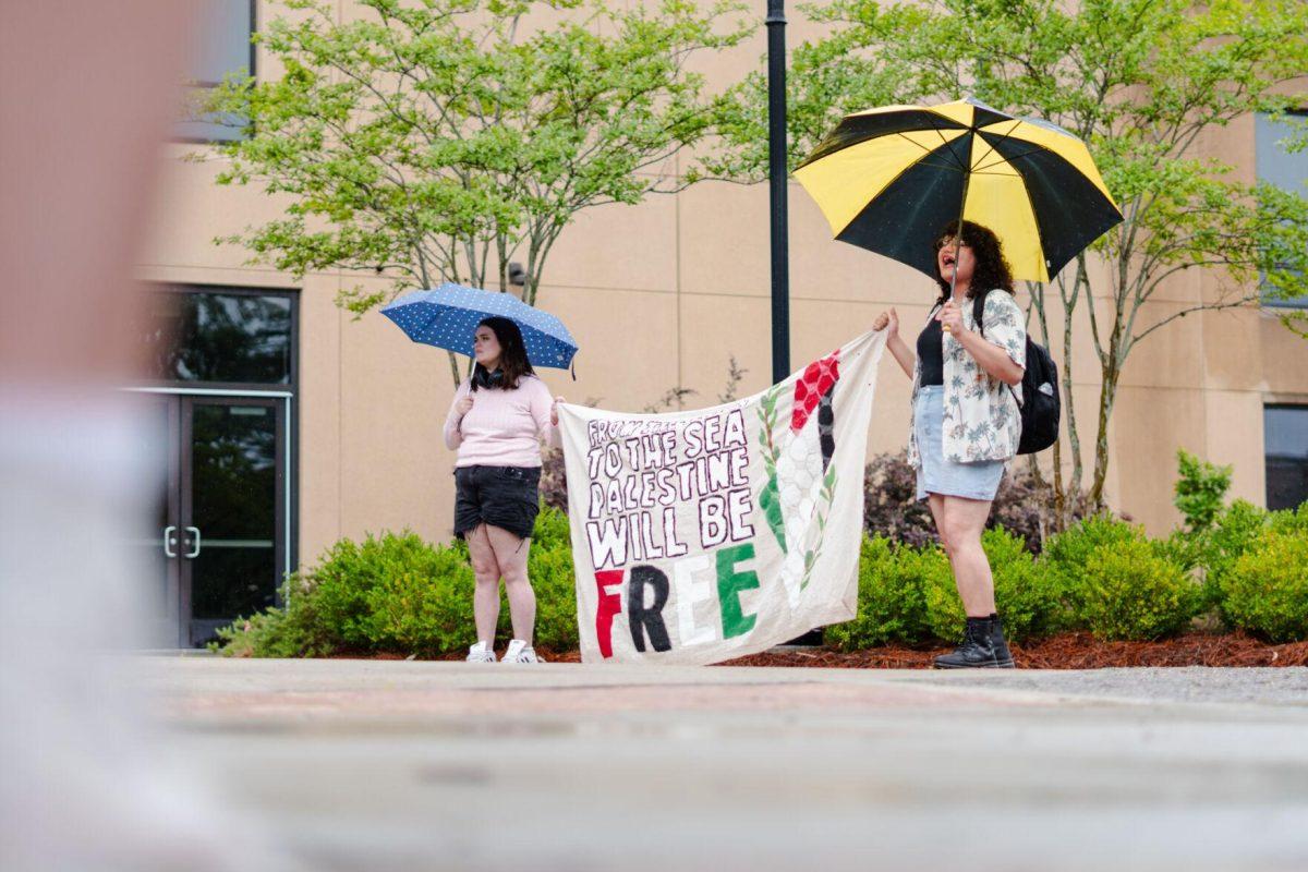 Pro-Palestinian protesters hold a banner reading "From the river to the sea Palestine will be free" Friday, May 3, 2024, outside of Patrick F. Taylor Hall on LSU's campus in Baton Rouge, La.