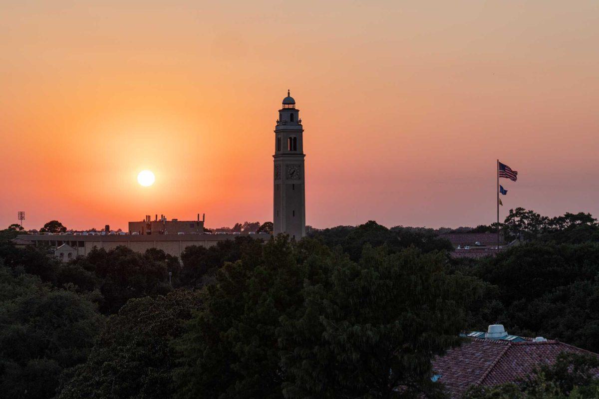 The sun sets behind Memorial Tower on Friday, Aug. 18, 2023, on LSU's campus in Baton Rouge, La.