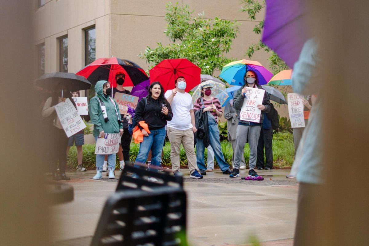 Pro-Palestinian protesters gather Friday, May 3, 2024, outside of Patrick F. Taylor Hall on LSU's campus in Baton Rouge, La.