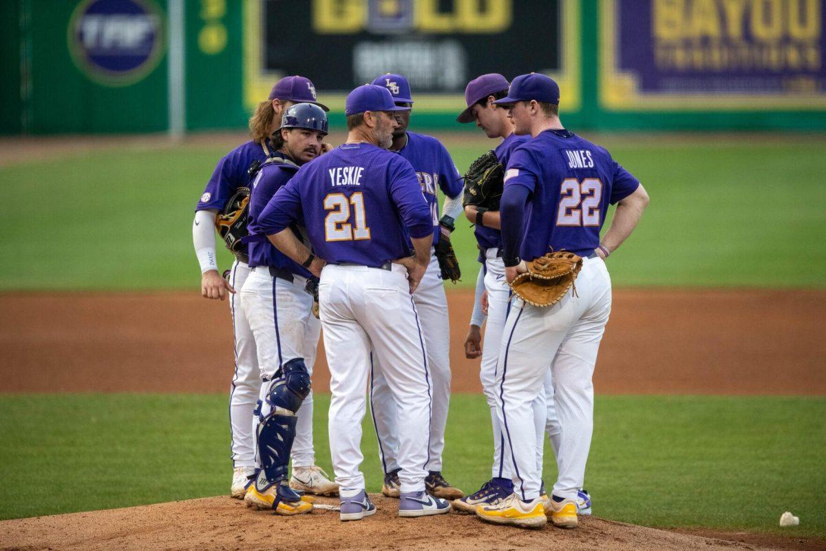 LSU baseball players meet up at the mound alongside pitching coach Nate Yeskie during LSU's 6-4 win on Saturday, May 4, 2024, at Alex Box Stadium in Baton Rouge, La.