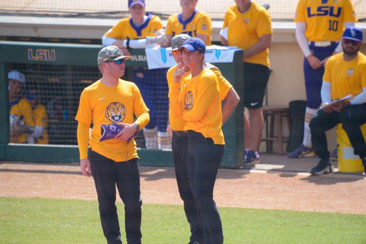 LSU softball head coach Beth Torina talks with assistant coach's Bryce Neal and Howard Dobson on Sunday, May 19, 2024,&#160;during LSU's&#160;9-0 win against Southern Illinois in the&#160;NCAA Regional Championship game at Tiger Park in Baton Rouge, La.