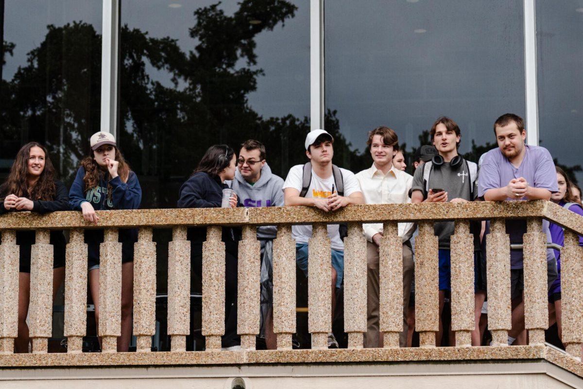 Students watch from the Student Union Friday, May 3, 2024, in Free Speech Alley on LSU's campus in Baton Rouge, La.