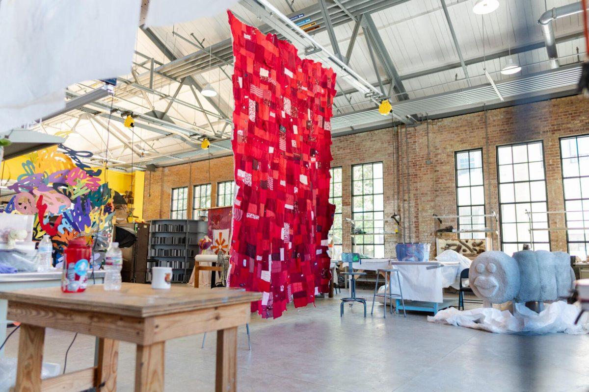 A quilt where each patch represents a report filed with the LSU Title IX office hangs Wednesday, May 1, 2024, inside the Barnes Ogden Art &amp; Design Complex on LSU's campus in Baton Rouge, La.