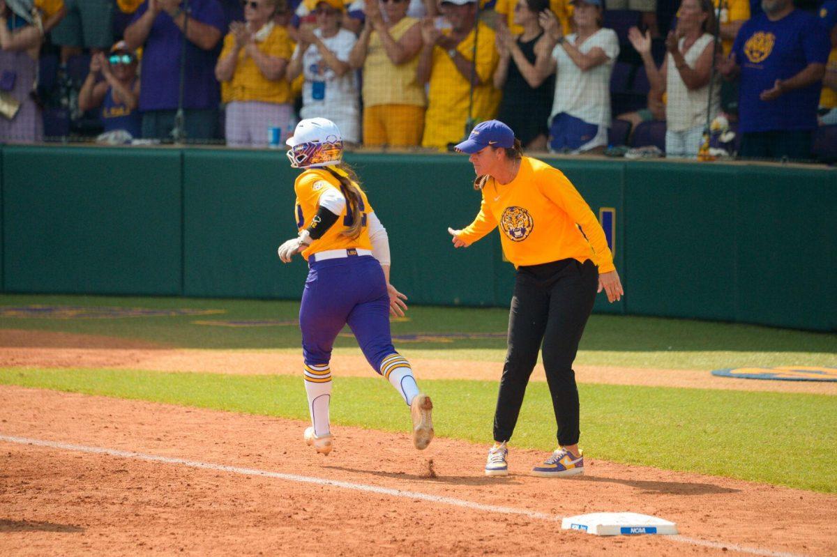 LSU softball sophomore catcher Maci Bergeron (12) runs in to score on Sunday, May 19, 2024,&#160;during LSU's&#160;9-0 win against Southern Illinois in the&#160;NCAA Regional Championship game at Tiger Park in Baton Rouge, La.