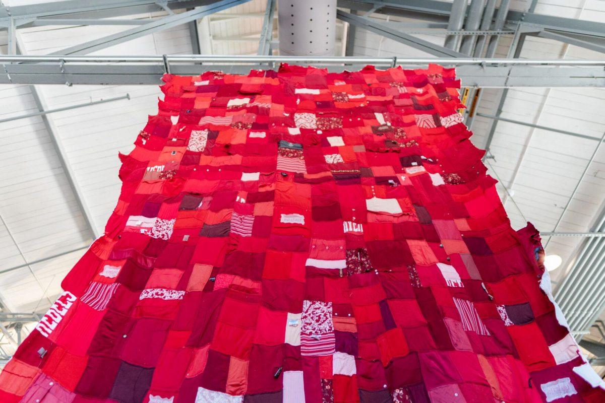 A quilt where each patch represents a report filed with the LSU Title IX office hangs Wednesday, May 1, 2024, inside the Barnes Ogden Art &amp; Design Complex on LSU's campus in Baton Rouge, La.