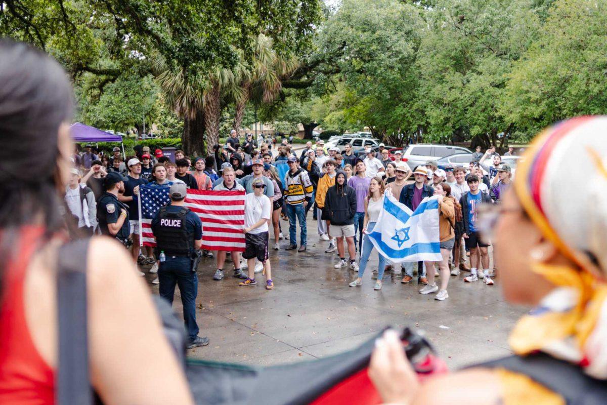 Counter-protesters stand opposite the pro-Palestinian protesters waving an American and Israeli flag Friday, May 3, 2024, in Free Speech Alley on LSU's campus in Baton Rouge, La.