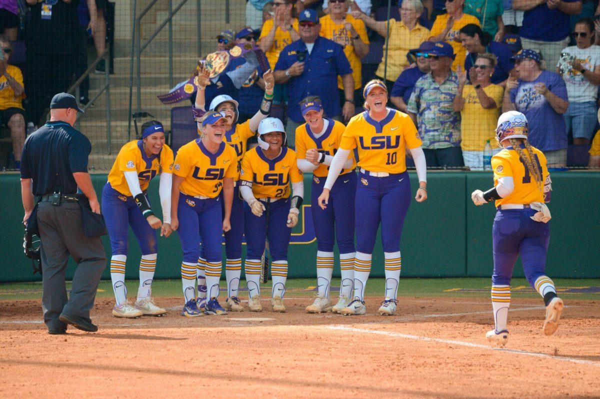 LSU softball graduate student infielder Karli Petty (14) celebrates homerun with teammates on Sunday, May 19, 2024,&#160;during LSU's&#160;9-0 win against Southern Illinois in the&#160;NCAA Regional Championship game at Tiger Park in Baton Rouge, La.