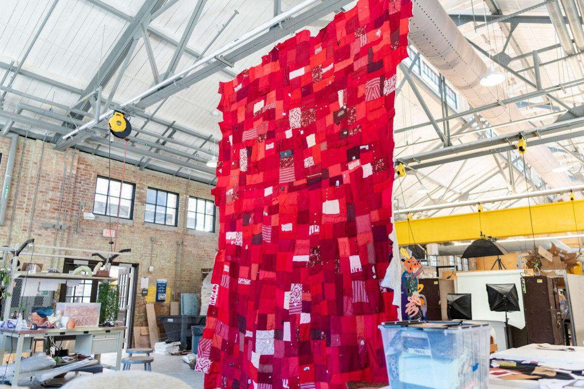 A quilt where each patch represents a report filed with the LSU Title IX office hangs Wednesday, May 1, 2024, inside the Barnes Ogden Art &amp; Design Complex on LSU's campus in Baton Rouge, La.