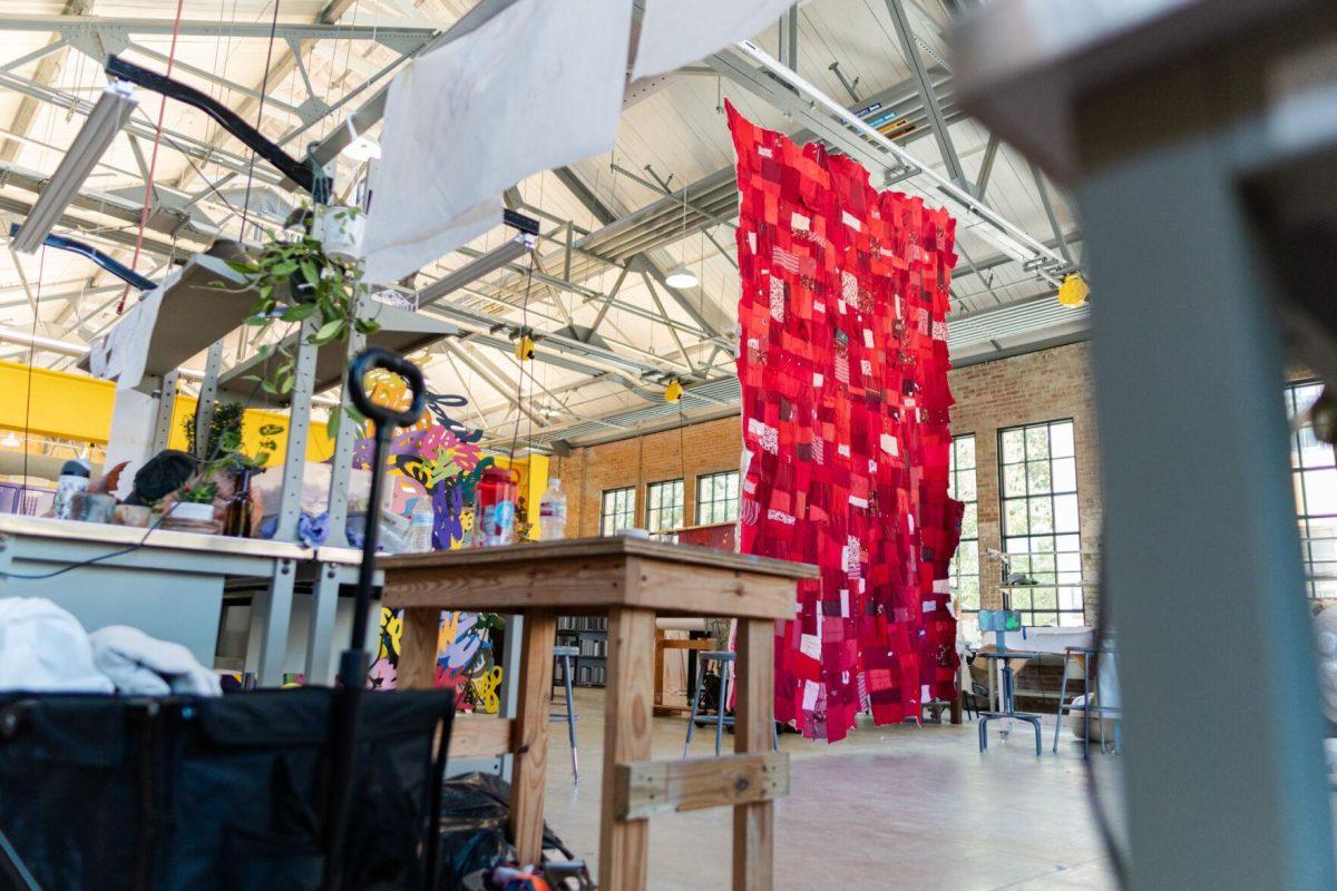 A quilt where each patch represents a report filed with the LSU Title IX office hangs Wednesday, May 1, 2024, inside the Barnes Ogden Art &amp; Design Complex on LSU's campus in Baton Rouge, La.