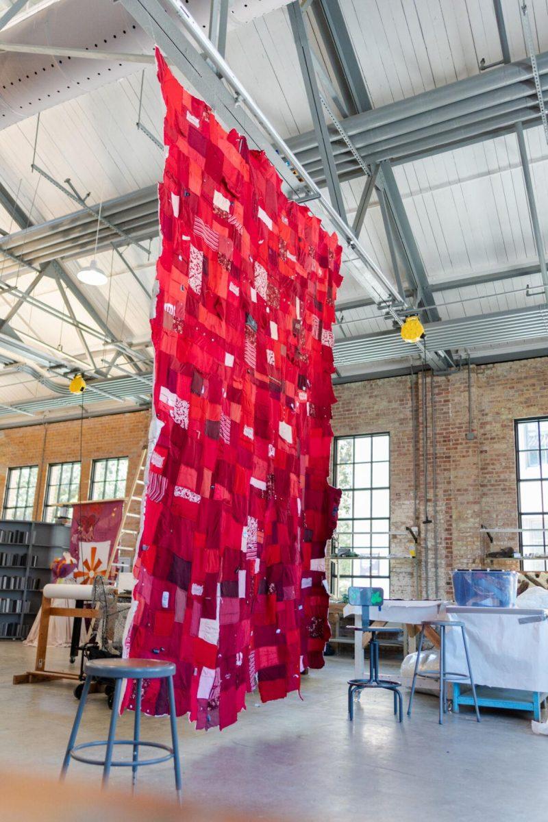 A quilt where each patch represents a report filed with the LSU Title IX office hangs Wednesday, May 1, 2024, inside the Barnes Ogden Art &amp; Design Complex on LSU's campus in Baton Rouge, La.