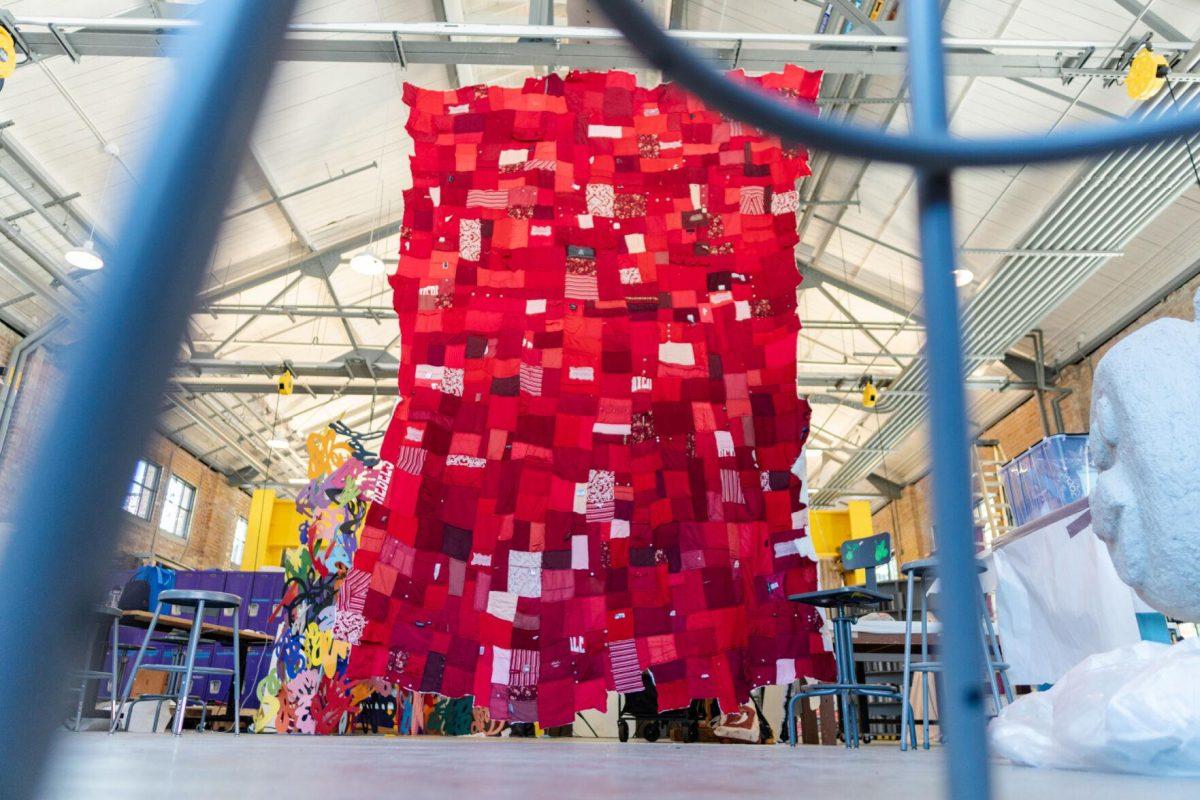 A quilt where each patch represents a report filed with the LSU Title IX office hangs Wednesday, May 1, 2024, inside the Barnes Ogden Art &amp; Design Complex on LSU's campus in Baton Rouge, La.