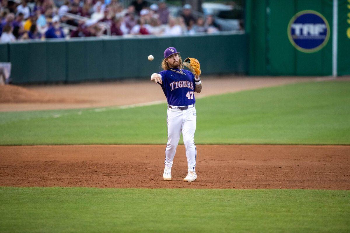 LSU baseball junior third baseman Tommy White (47) throws the ball during LSU's 6-4 win on Saturday, May 4, 2024, at Alex Box Stadium in Baton Rouge, La.