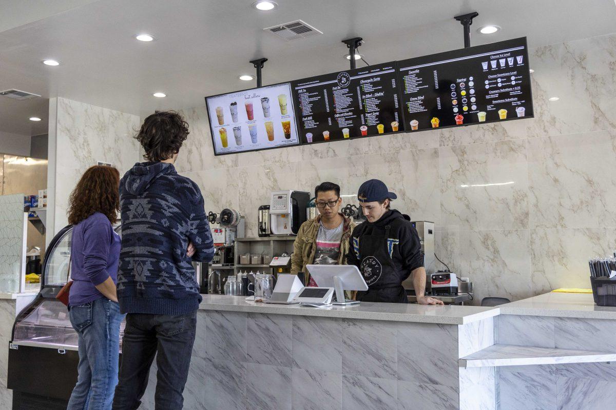 Teatery owner Hau Le and cashier Ryzen Lemoine take customers' orders Saturday, Nov. 12, 2022, at Teatery Tea and Tapioca on 3132 College Drive.&#160;