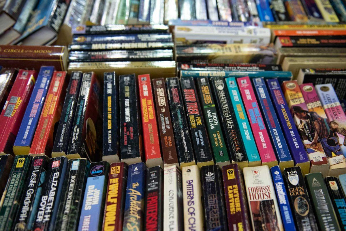 Science fiction books fill a table Sunday, April 14, 2024, during the Friends of the LSU Libraries Book Bazaar at the John M. Parker Agricultural Coliseum in Baton Rouge, La.