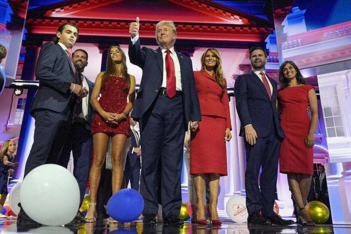 Republican presidential candidate former President Donald Trump stands on stage with former first lady Melania Trump, family members, and Republican vice presidential candidate Sen. JD Vance, R-Ohio, and his wife Usha Chilukuri Vance, during the 2024 Republican National Convention at the Fiserv Forum, Thursday, July 18, 2024, in Milwaukee.