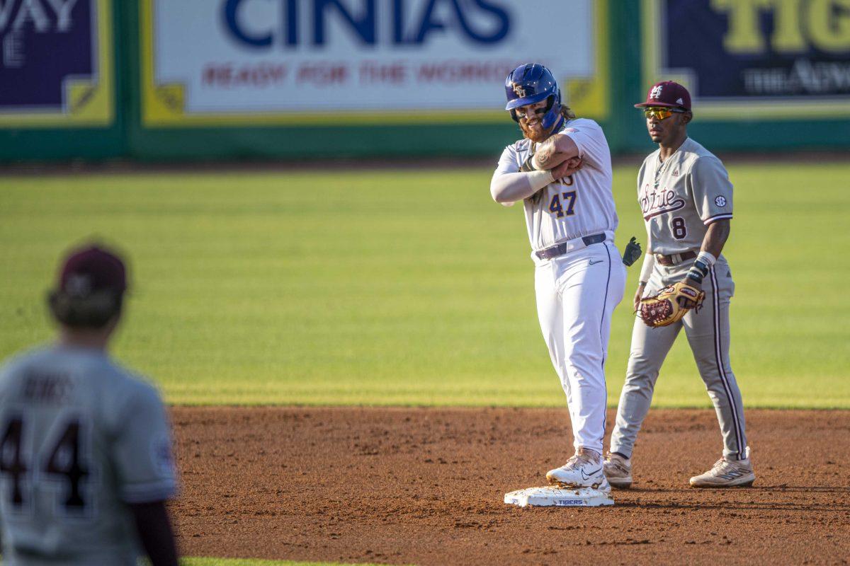 LSU baseball sophomore third-base Tommy White (47) celebrates a run to second base from bat Saturday, May 13, 2023, during LSU's 9-4 lost to Mississippi State at Alex Box Stadium in Baton Rouge, La.