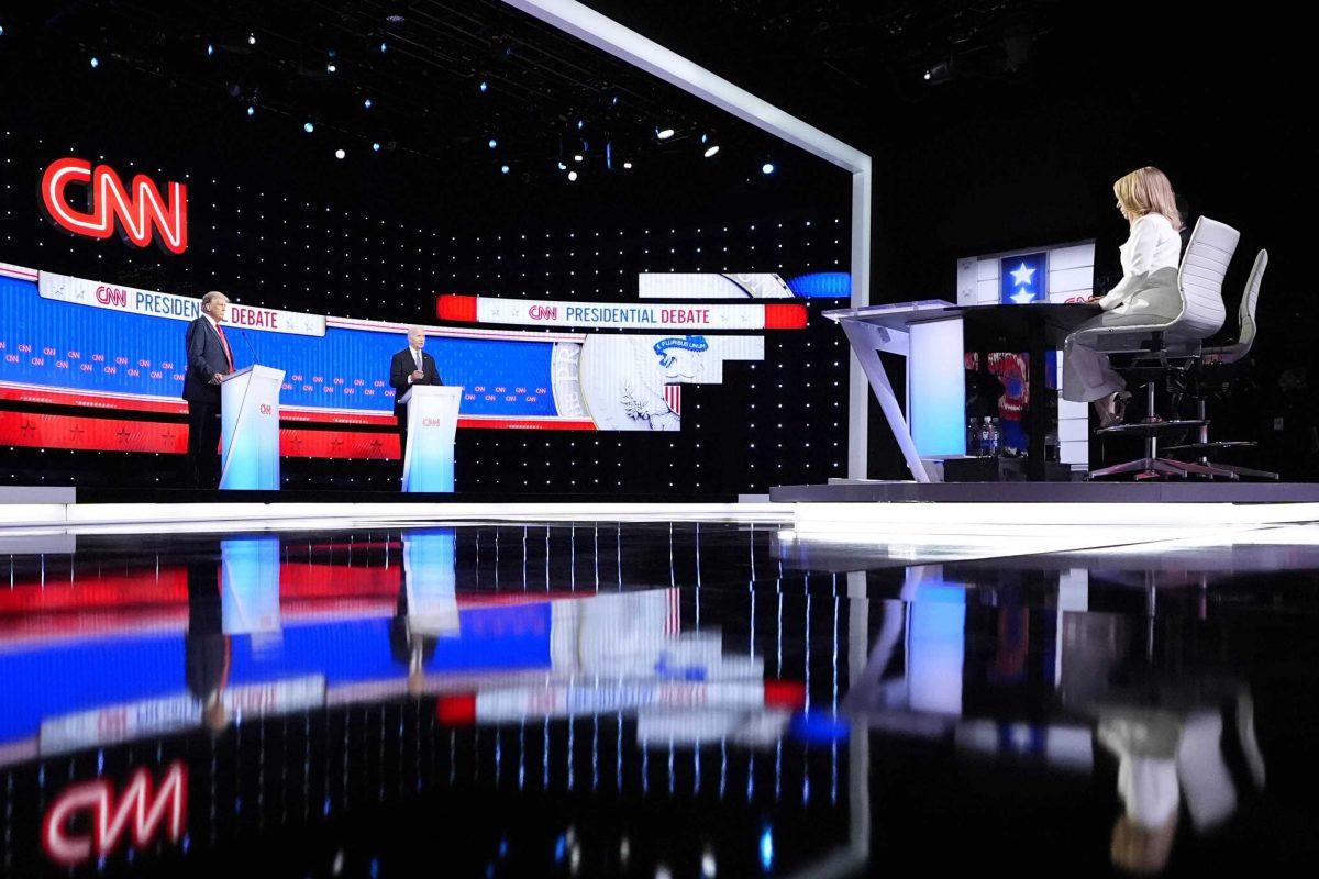 President Joe Biden, on stage at right, and Republican Presidential candidate former President Donald Trump, left, participate in a presidential debate hosted by CNN, Thursday, June 27, 2024, in Atlanta.