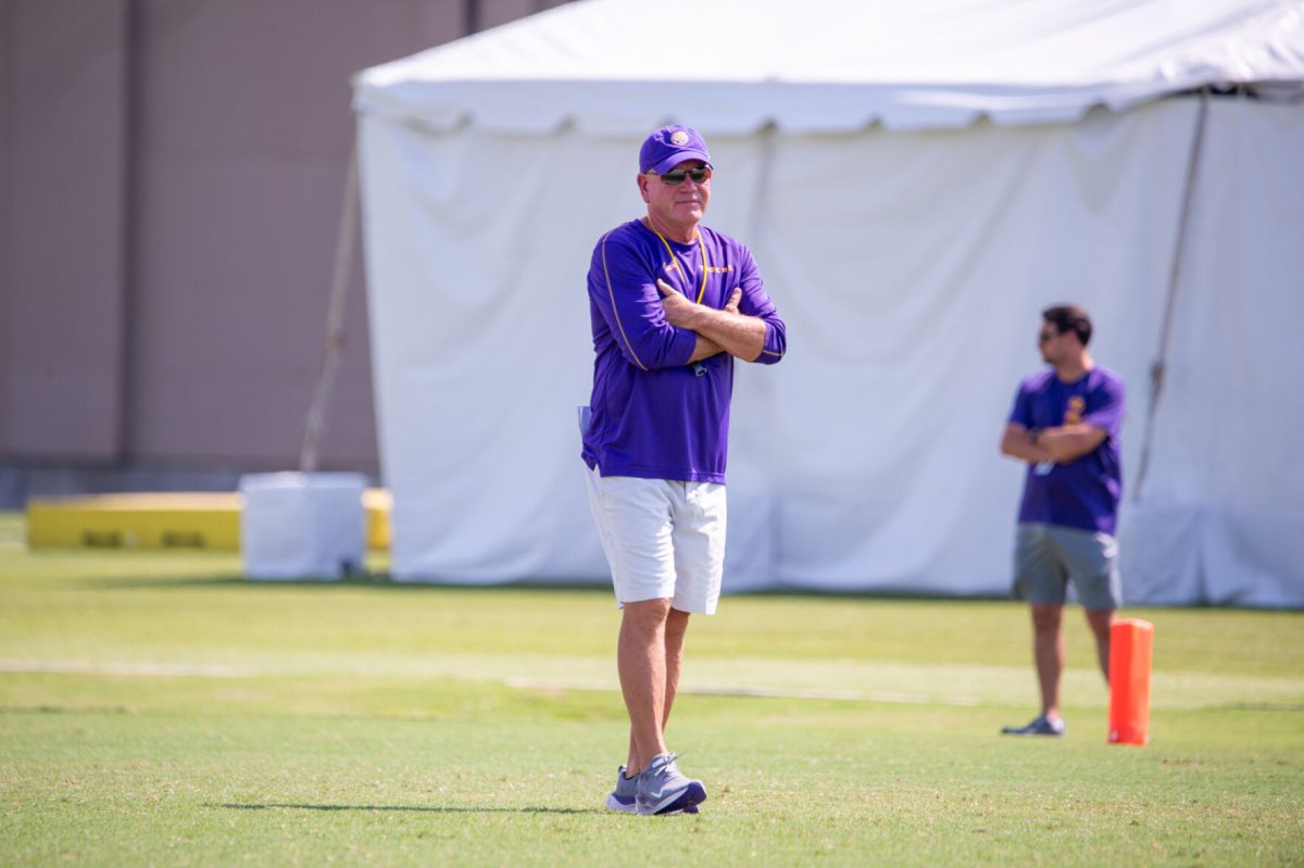 LSU football head coach Brian Kelly scouts practice smiling during the LSU Fall Camp practice on Saturday, Aug. 17, 2024, in Baton Rouge.