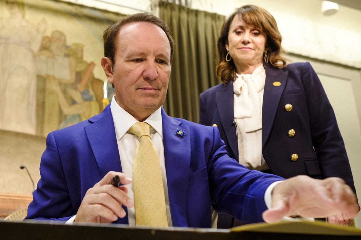 Gov. Jeff Landry, next to Attorney General Liz Murrill, signs an executive order that will require Louisiana agencies to accompany voter registration forms with a disclaimer explaining it's illegal for non-citizens to vote. This, at the Louisiana State Capitol on Monday Aug. 26, 2024.&#160;