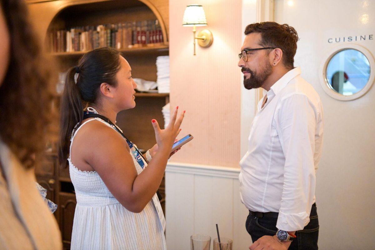 LSU mass communication graduate student Marileah Niddrie interviews a server for her project at Sir Winston's in Paris, France on Thursday, August 1, 2024.