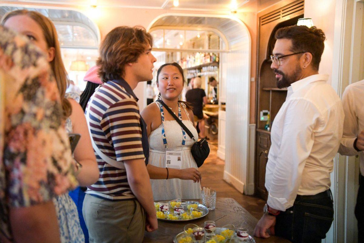 LSU mass communication students talk to a server at Sir Winston's in Paris, France on Thursday, August 1, 2024.