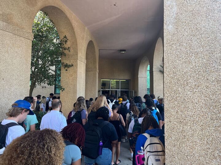 Students pile into Allen Hall after fire alarms pushed them outside on August 28, 2024.