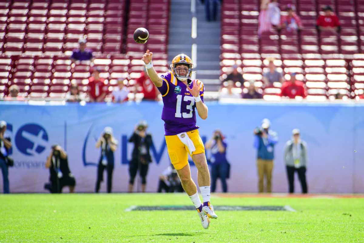 LSU football redshirt sophomore quarterback Garrett Nussmeier (13) throws a pass down field on Monday, Jan. 1, 2024, during LSU's 35-31 victory against Wisconsin in Raymond James Stadium in Tampa, Fl.