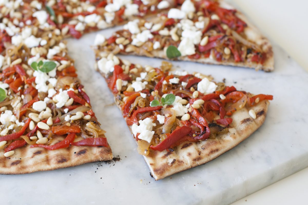 This April 21, 2014, photo shows a caramelized onion and feta grilled pizza in Concord, N.H.